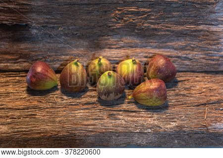Fresh Fig Fruits (ficus Carica L.) With Peel On A Piece Of Aged Wood