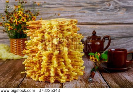 Lithuanian Traditional Layered Cake Sakotis With Tea On Wooden Surface.