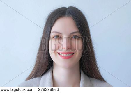 Closeup Portrait Of Brunette Young Woman In Suit Smiling On White Backgroundlooking At Camera. Beaut