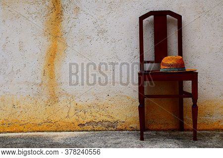 A Wooden Chair Outside In The Park
