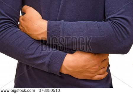 A Man Holds His Stomach Because He Has Diarrhea. Abdominal Pain, Indigestion Due To Poor Nutrition. 