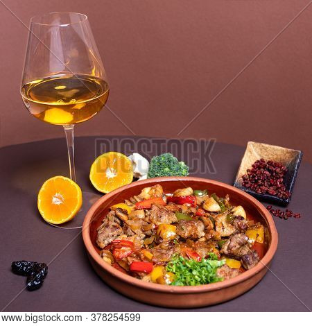 Tasty Meat Meal With White Wine Glass