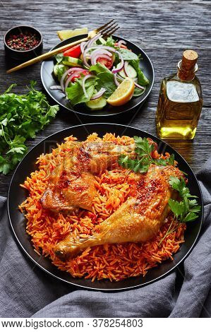 Crispy Baked Chicken Leg Quarters Over Indian Tomato Rice And Fresh Salad Of Tomatoes, Baby Spinach,