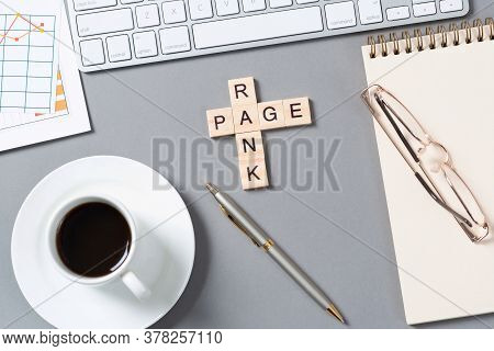 Rank Page Concept With Letters On Cubes. Still Life Of Office Workplace With Crossword. Flat Lay Gre