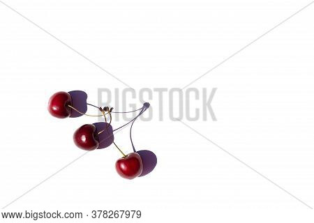 Three Sweet Cherries On White Background. Copy Space. Illustration Of Fake Friendship. Cherries Are 