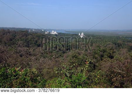 Old Goa along Mandovi River with Se Cathedral in front of Church of St Francis of Assisi, left, and Church of St Cajetan, right, Goa, India
