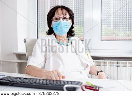 Woman Doctor With Mask Portrait. Pulmologist For Covid-19. Doctor Pulmonologist With Mask In Covid-1