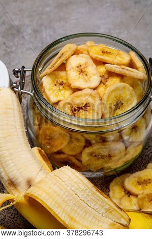 Healthy Sweet Snack, Crispy Dehydrated Unsugared Banana Chips In Glass Jar