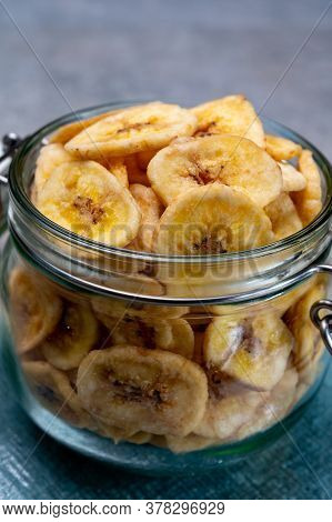 Healthy Sweet Snack, Crispy Dehydrated Unsugared Banana Chips In Glass Jar
