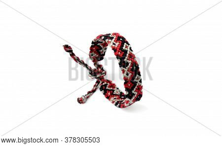 Selective Focus Of Tied Woven Friendship Bracelet With Bright Colorful Pattern Handmade Of Thread Is