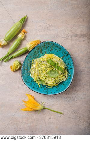 Zucchini Vegetable Noodles - Green Zoodles Or Courgette Spaghetti On Plate Over Gray Background. Cle