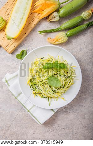 Zucchini Vegetable Noodles - Green Zoodles Or Courgette Spaghetti On Plate Over Gray Background. Cle
