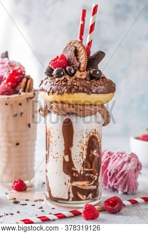 Feakshake. Chocolate Indulgent Frosting Exreme Milkshake With Donut  And Sweets. Crazy Freakshake Fo