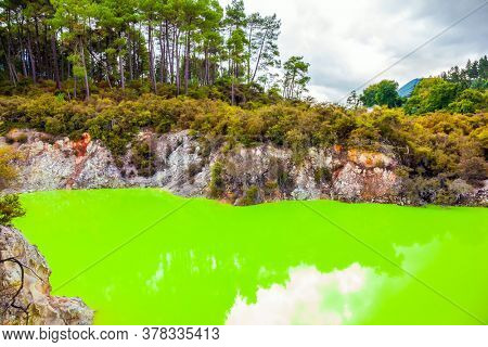 The unique geothermal area of Rotorua. Devil's Bath with bright green color of water. Volcanic Valley Waimangu, Wai-O-Tapu. New Zealand, North Island. Extreme, exotic and photo tourism concept