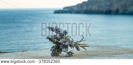 Beautiful Greek Wild Lavender On The Background Of The Sea On Natural Wooden Background. Copy Space 