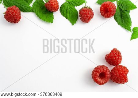 Ripe Raspberries Isolated On White Background Close-up. Beautiful Red Fresh Raspberries With Leaves 