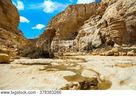 Beginning of a route. The concept of photo tourism. The magnificent gorge Ein Avdat is the most beautiful in the Negev desert. Within the walls there are many caves and rocks. Israel