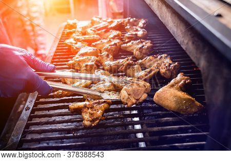 Fried Chiken Wings At Grill Barbecue. Restaurant.