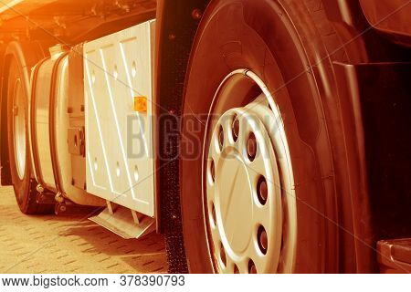 Front Wheel With Disc Cap Of Semi-truck Trailer European Type Close-up. Warm Editing With Pop Filter