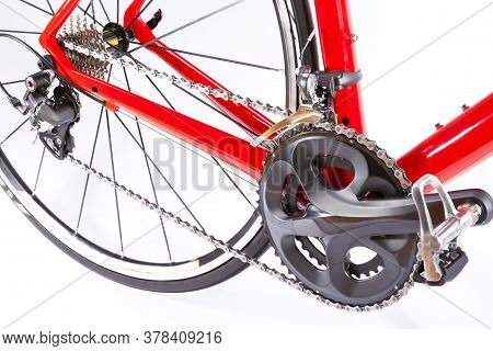 Cycling Ideas. Crankset And Rear Cassette With New Chain. Against White. Horizontal Image