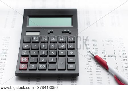 Financial Activity, Accounting, Tax Calculation Or Saving And Investment, Black Calculator With Pen