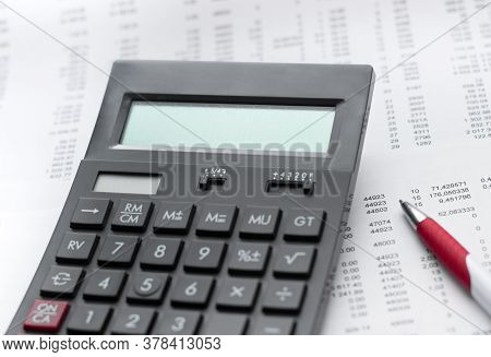 Financial Activity, Accounting, Tax Calculation Or Saving And Investment, Black Calculator With Pen