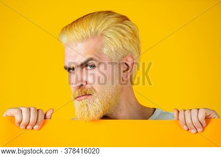 Caucasian Blond Male Model Posing In Fashion Concept Studio Shoot. Happy Middle Age Man Presenting E