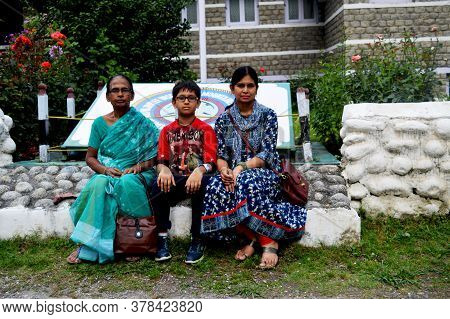 Manali, Himachal Pradesh, India, 27 June 2017: Two Indian Women And Children Sitting In Front Of  Av