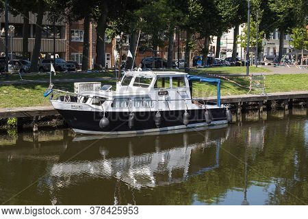 Lokeren, Belgium, July 13, 2020, Black And White Pleasure Boat Moored On The River Durme
