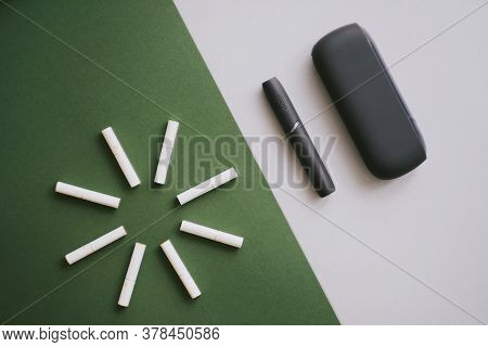 Heating Tobacco System Iqos With Heat Sticks, Iqos Tobacco Product Technologies . High Quality Photo