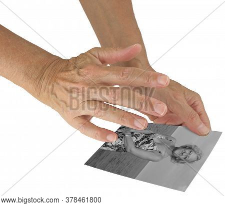 Sending Distant Healing To Woman Via Photograph - Holding A Black And White Photo Of A Middle-aged F