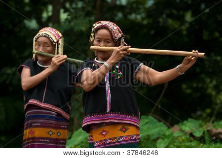 Hilltribe Playing Flute .