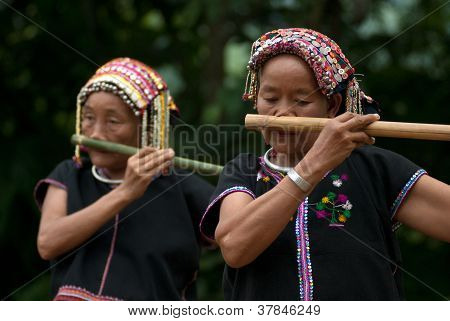Hilltribe Playing Flute .