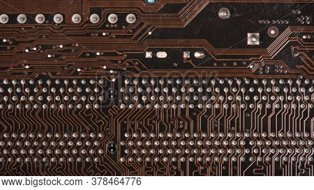 Modern printed brown circuit board, electronic circuit board, textolite. Background banner.
