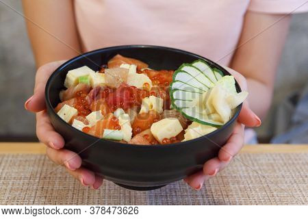 Japanese Food. Hand's Woman Holding Rice Of Salmon, Tuna ,tekka Don