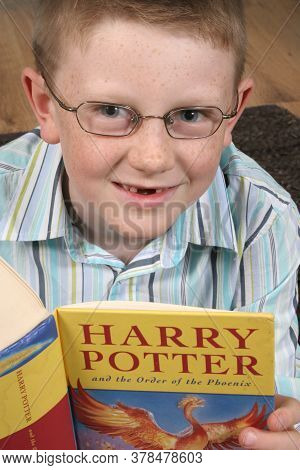 A Boy In Glasses Reading Harry Potter And The Order Of The Phoenix, Taken On The 11th December 2007 