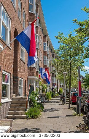 Flags on the houses in Amsterdam in the Netherlands at kingsday