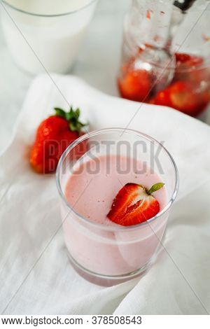 Organic Probiotic Milk Kefir Drink Or Yogurt With Strawberry In Glass On The White Grey Background. 