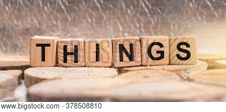 Wooden Blocks With The Word Things. Business And Finance Concept.