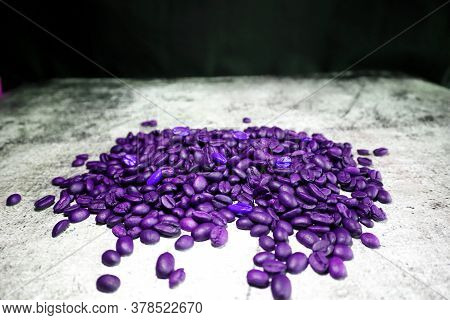 Lot Of Coffee Beans On A Concrete Board