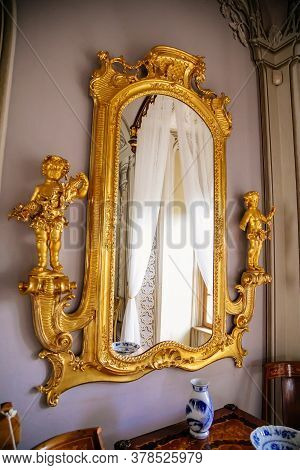 Luxury Vintage Mirror In Gold Frame. Interior Of Castle Bitov, South Moravia Region, Czech Republic,