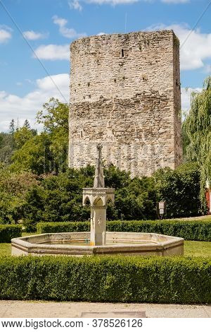 Fountain In The Courtyard Of The Castle And A Fragment Of A Stone Wall. Castle Bitov, South Moravia 