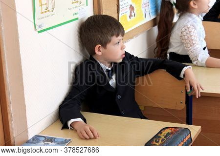 Moscow, Russia - September 1, 2017: Schoolboy, Pupil Sitting At The Desk In Class At School, Traditi