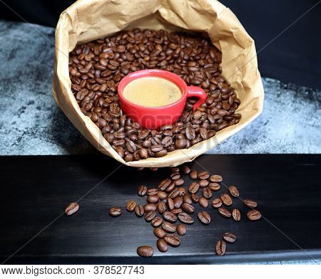 Espresso Cup In A Paper Bag With Coffee Beans
