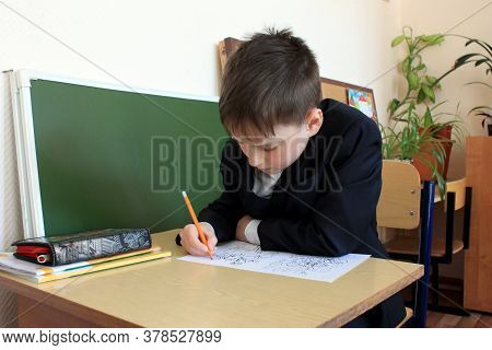 Moscow, Russia - September 1, 2017: Schoolboy, Pupil Sitting At The Desk In Class At School, Traditi
