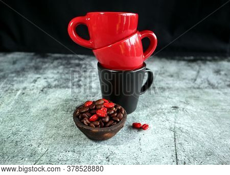 Ceramic Coffee Cups And A Clay Bowl With Coffee Beans