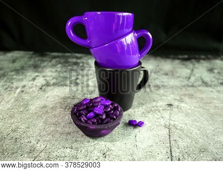 Ceramic Coffee Cups And Coffee Beans On A Concrete Board