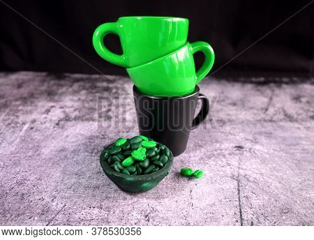 Ceramic Espresso Cups And Coffee Beans In A Clay Pot