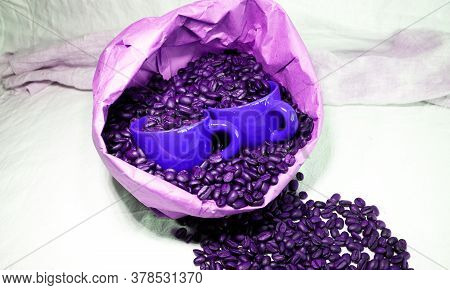 Ceramic Coffee Cups In A Paper Bag With Coffee Beans