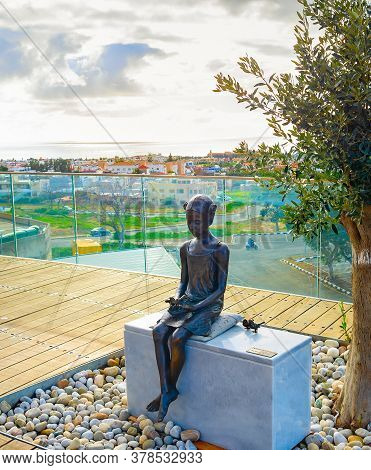 Paphos, Cyprus - February 15, 2019: The Girl And The Sparrow Sculpture At The Touristic View Point, 